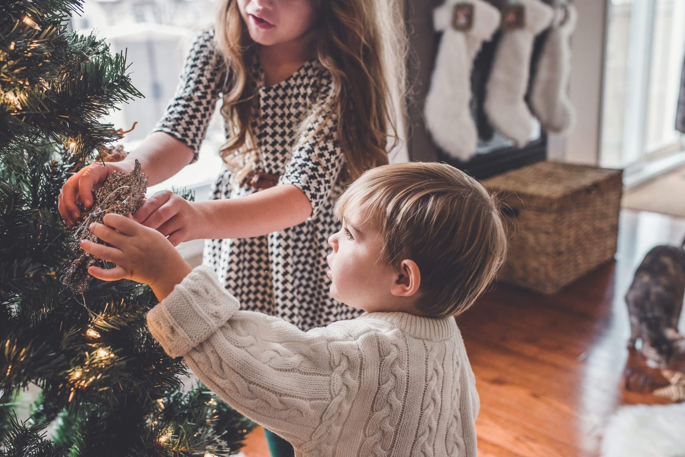 Family decorating christmas tree